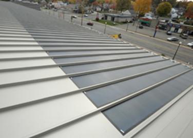 Solar panels cover a portion of the roof on the McPherson Field house